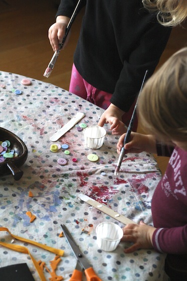 painting craft sticks for snowman ornaments