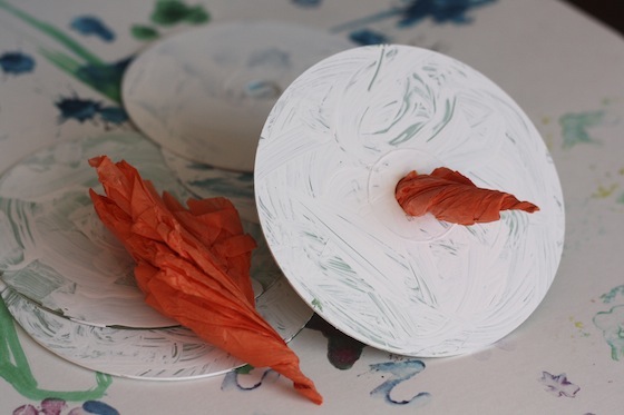 White CD with a tissue paper carrot nose